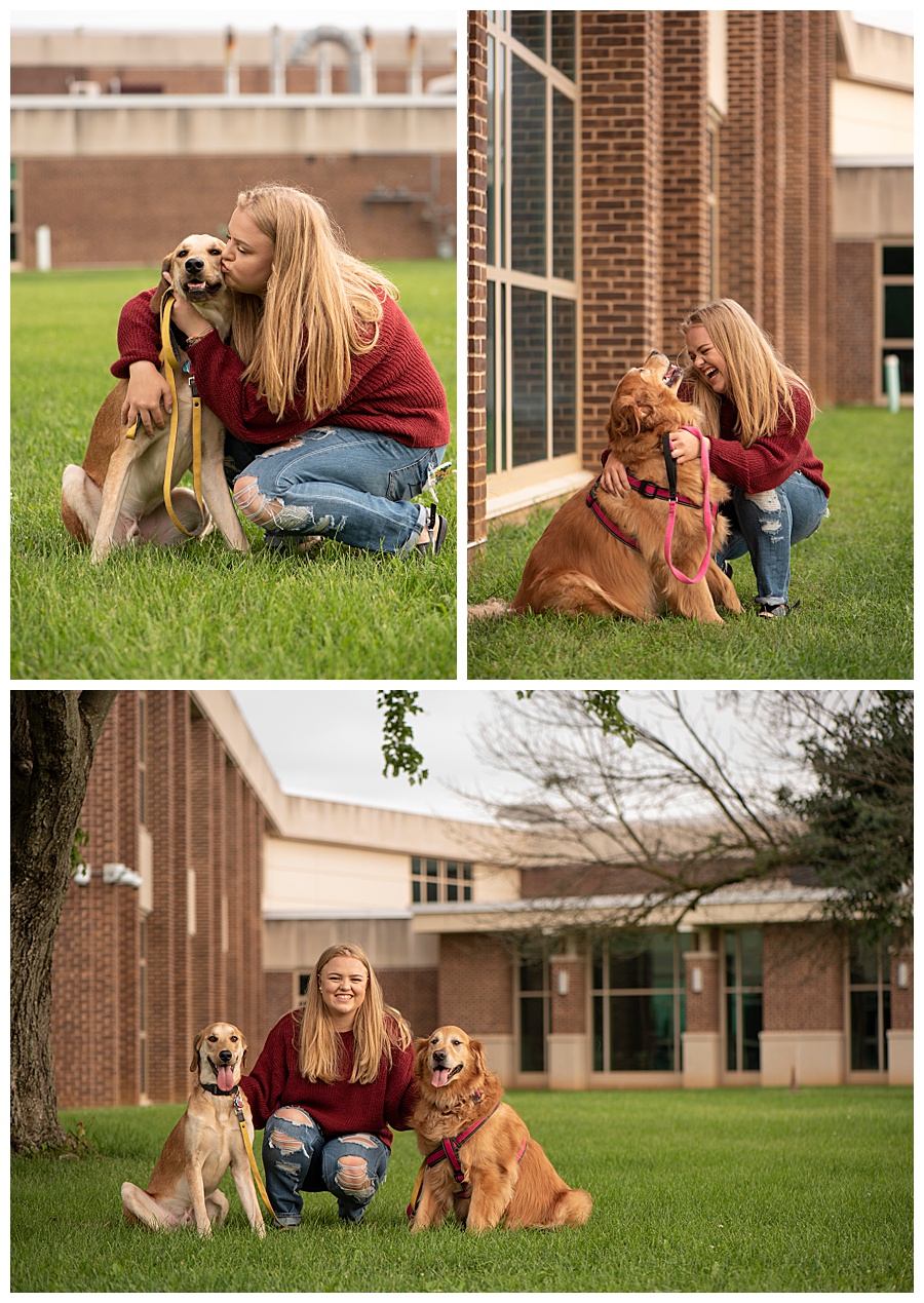 Senior girl pictures with dogs in front of brick building.